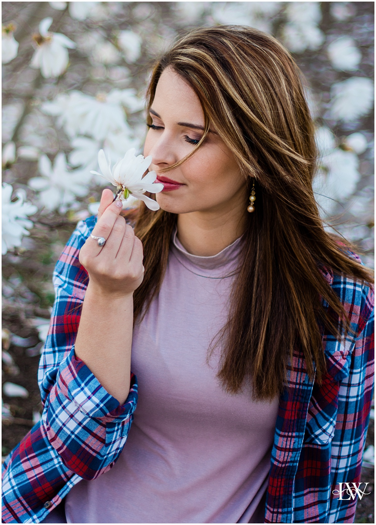 gorgeous girl smelling spring flowers | Wesleyan University Graduation in Virginia Beach by Photographer Laura Walter