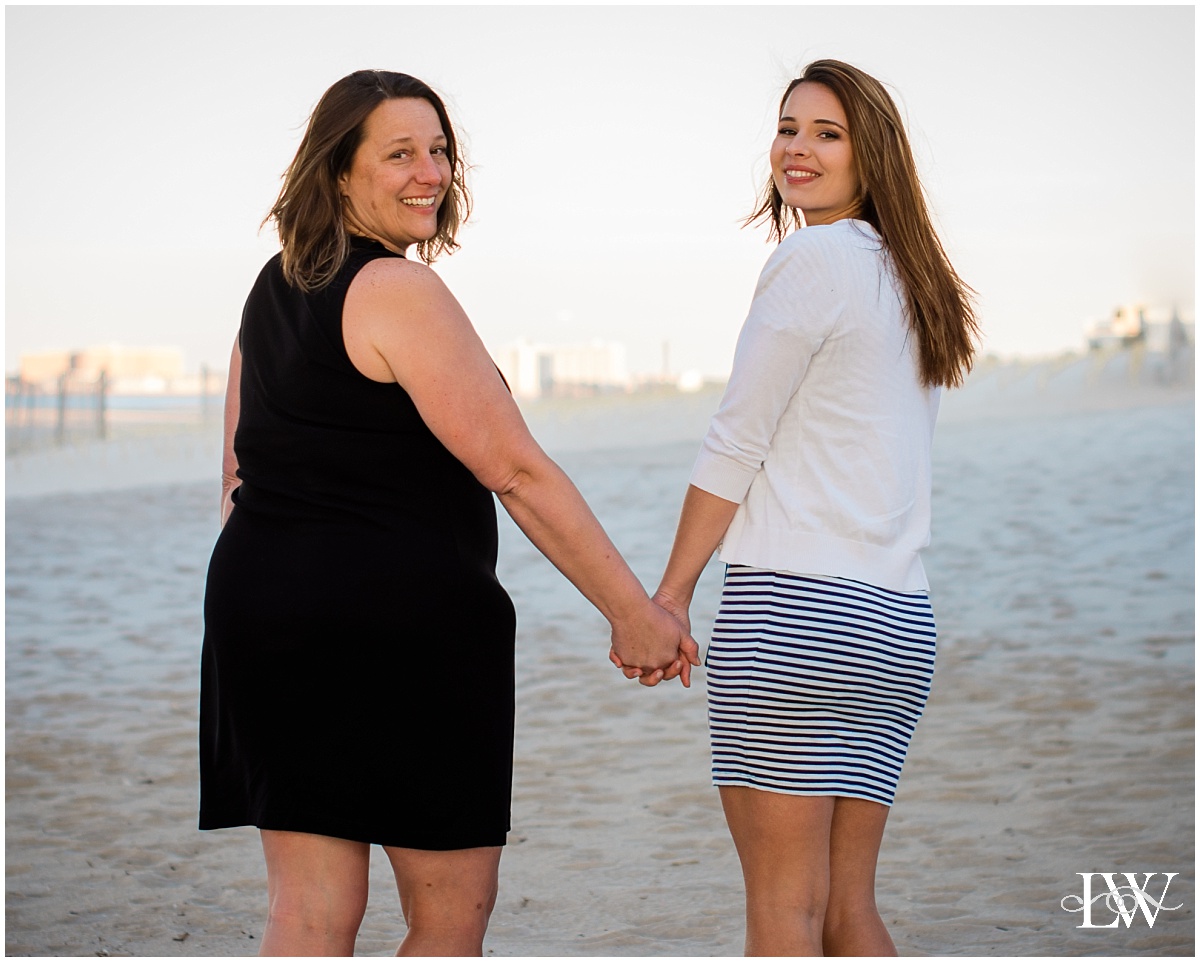 Mom and Daughter holding hands on the beach |Wesleyan University Graduation in Virginia Beach by Photographer Laura Walter