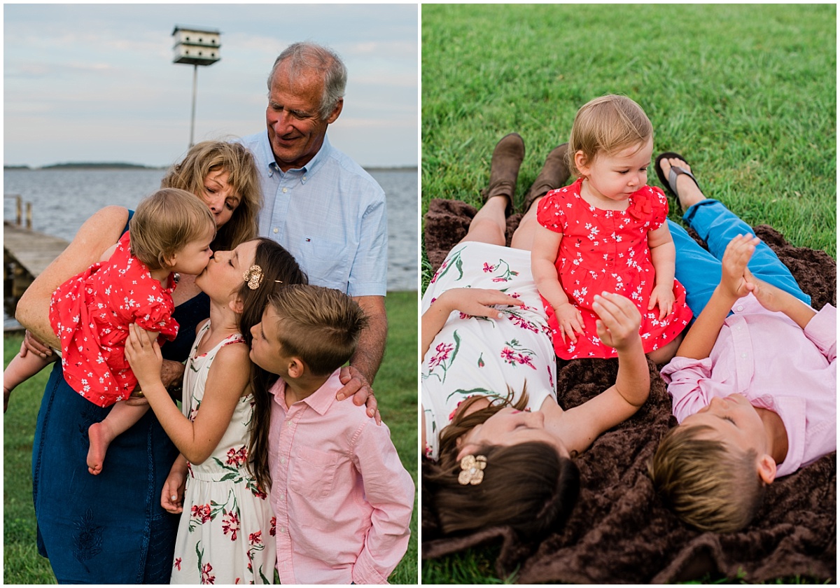 Currituck County soundside Family photo session, grandparent with theire grandchildren, cute baby kissing a little girl, while grandma holds her and three children lay on a blanket in the grass.  Photos by Laura Walter Photography