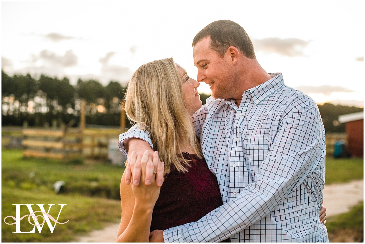 Engaged couple Nose to Nose on the farm in Currituck, taken by Laura Walter Photography.