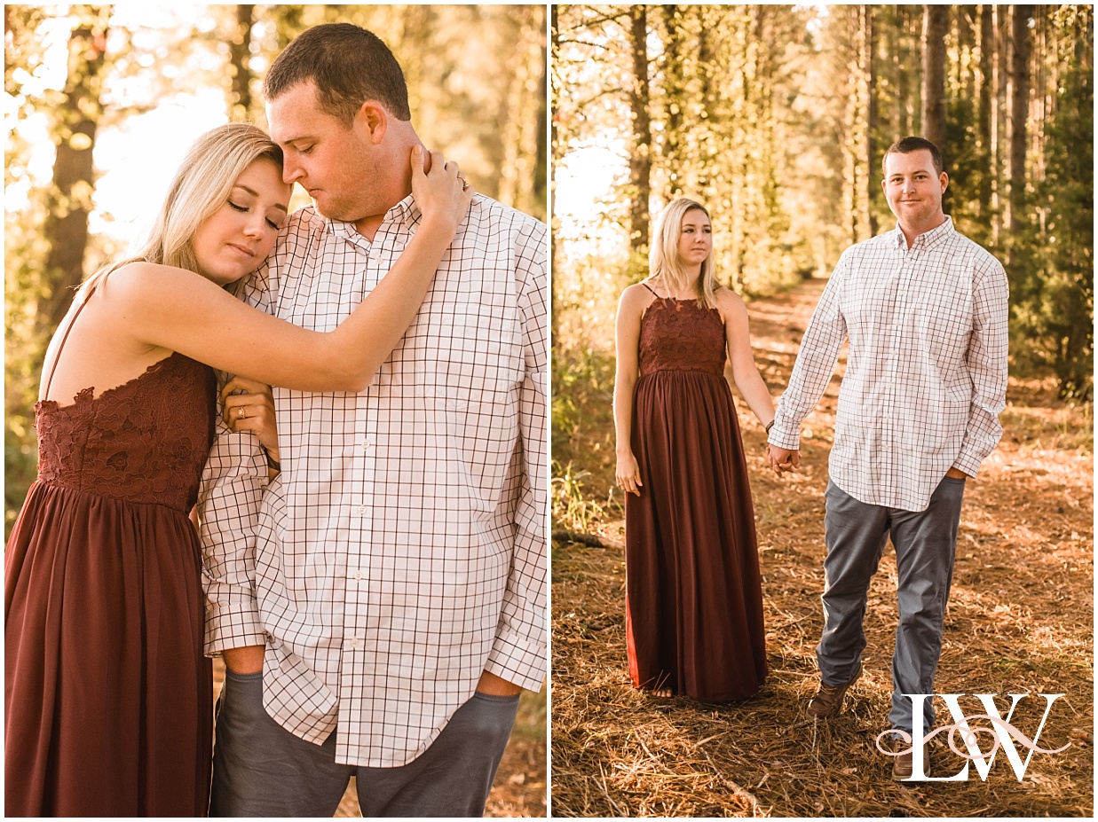 Engaged couple standing and playing together in the forest in Currituck, NC taken by Laura Walter Photography.