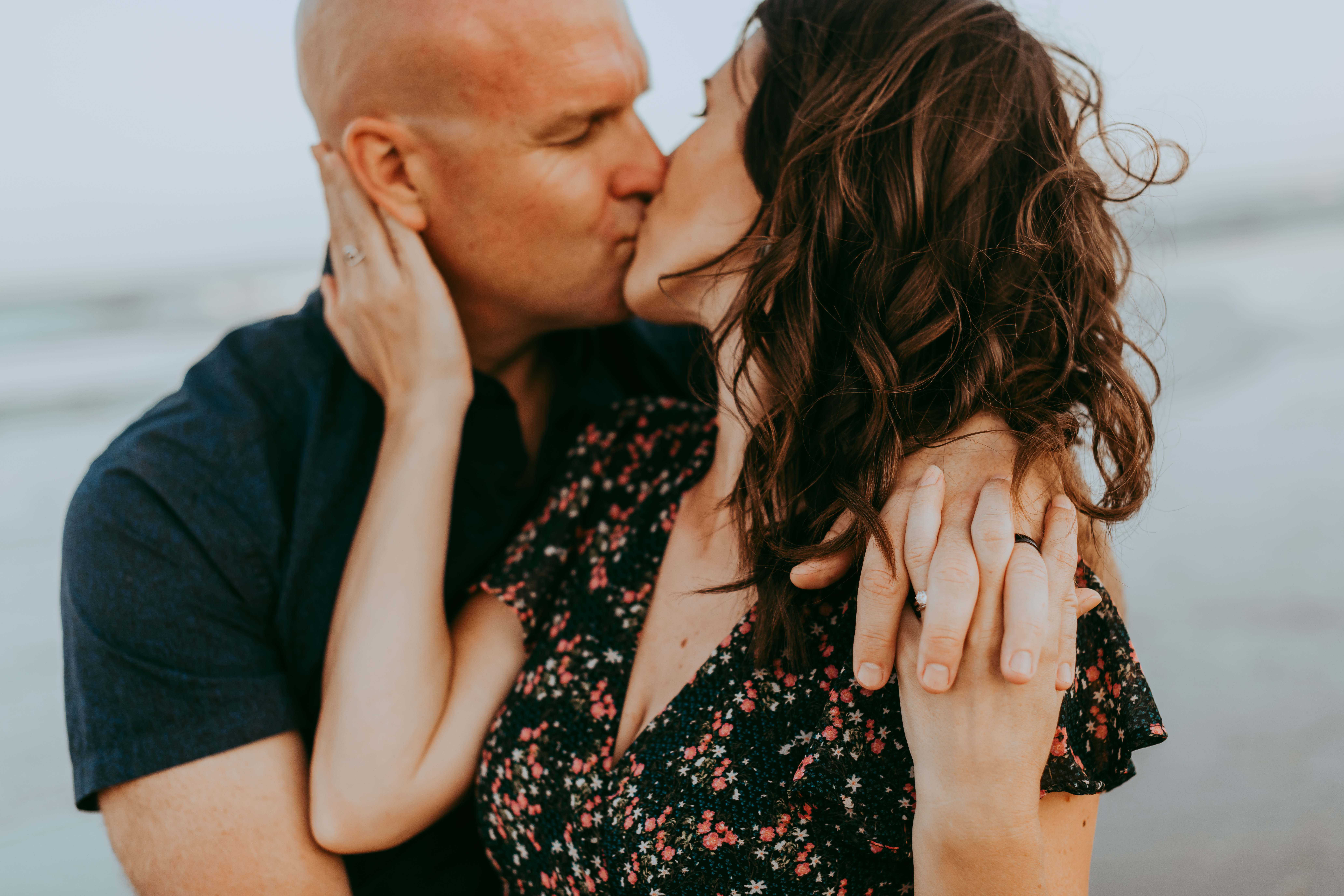 stunning couple kissing on the beach Family Photo Sessions in Corolla by Laura Walter Photography