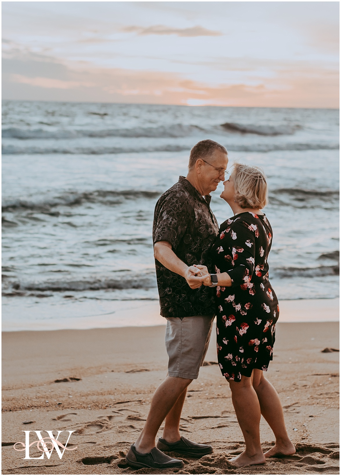 Couple dancing on the beach at Outer Banks by Laura Walter Photography