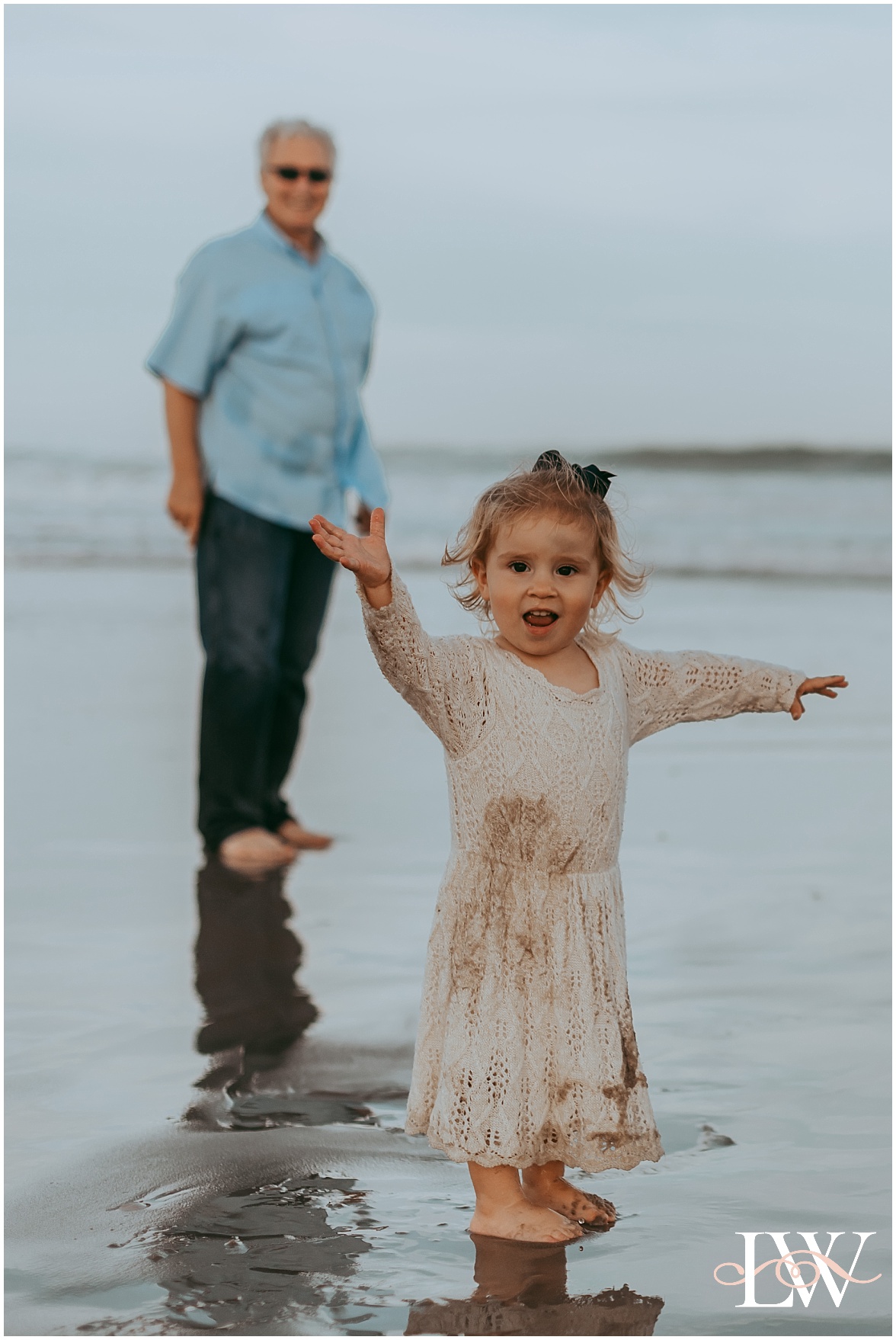 Playing on the beach in Corolla, NC family session by Laura Walter Photography